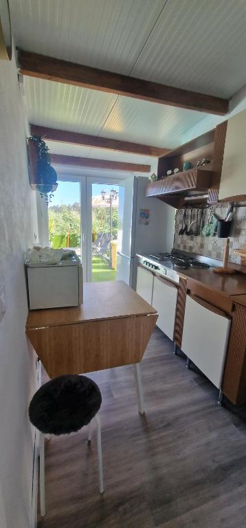 Kuchyň nebo kuchyňský kout v ubytování El refugio los portales