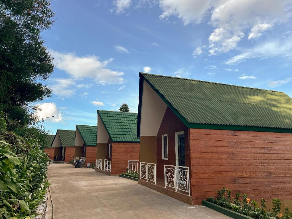 a row of buildings with green roofs at Ciater Dream Village in Cicadas