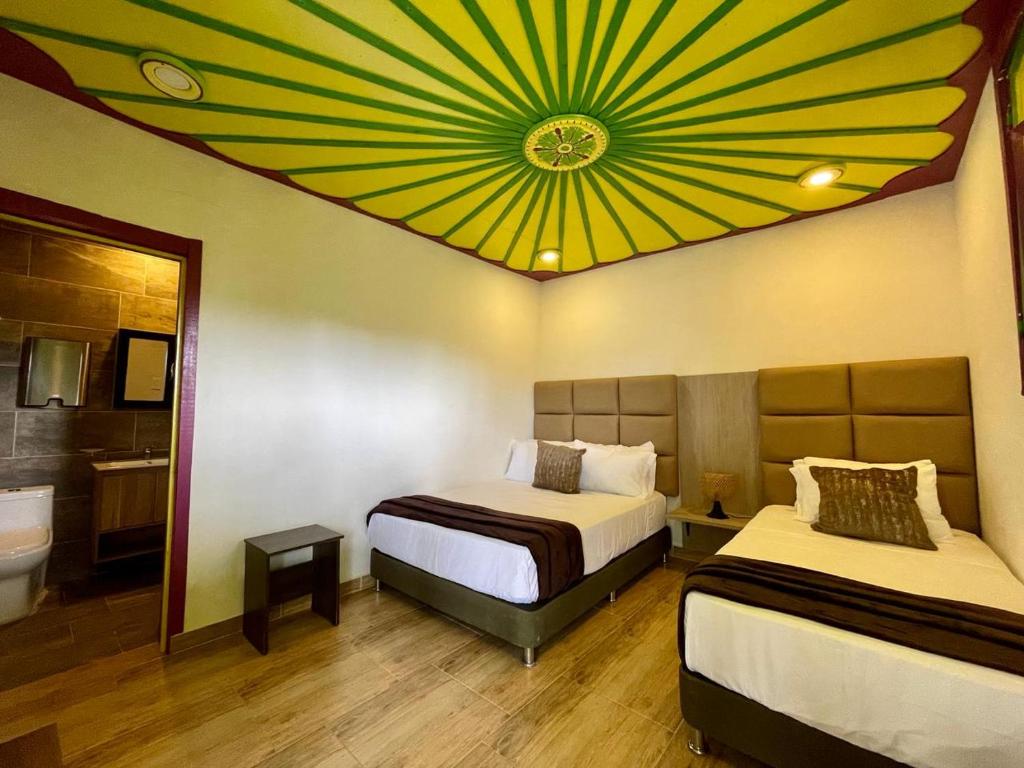 Postel nebo postele na pokoji v ubytování Dreams Hotel y Restaurante