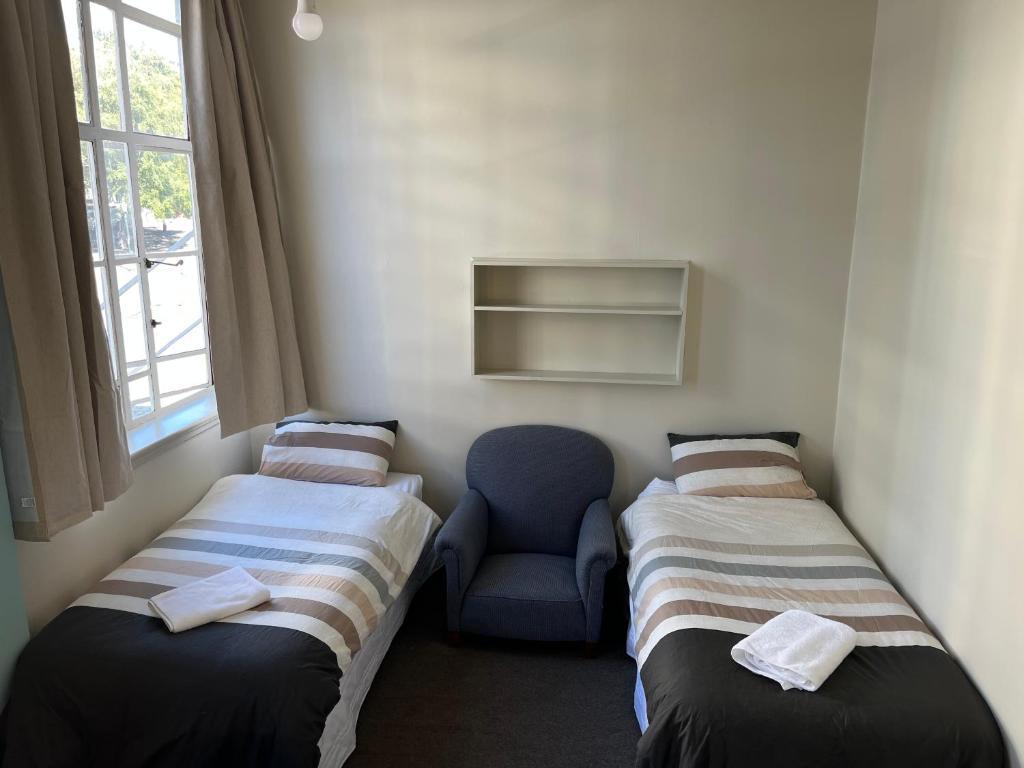 Postel nebo postele na pokoji v ubytování UpTown Backpackers