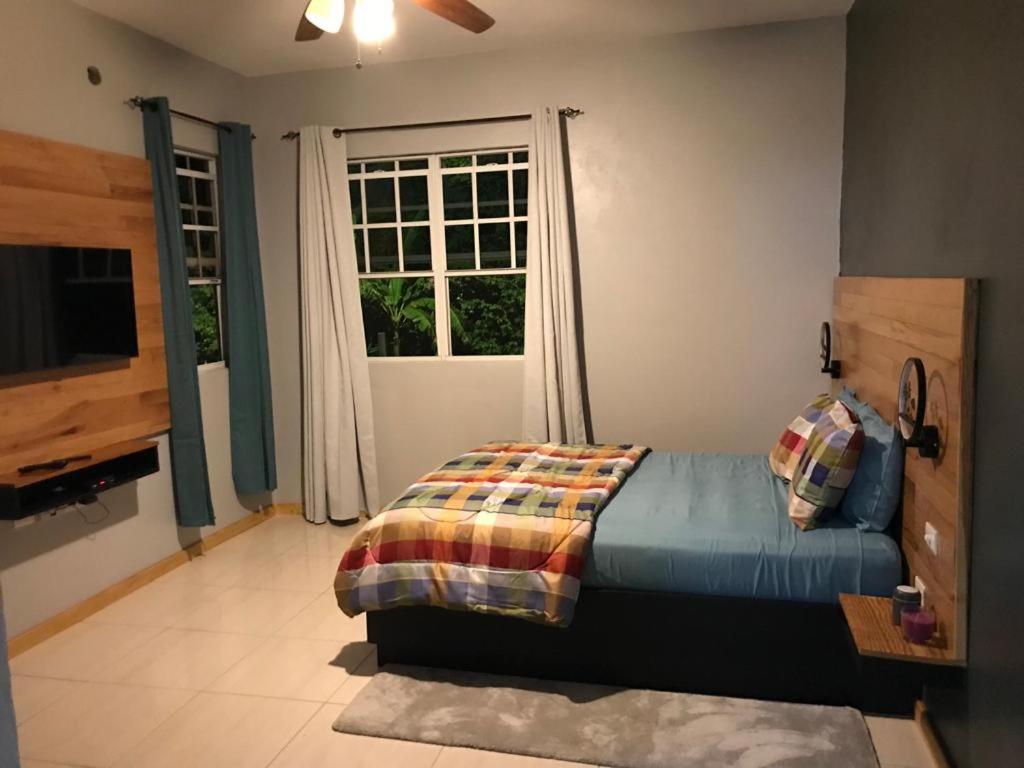 a bedroom with a bed in front of a window at Mountain View Vacation Home 