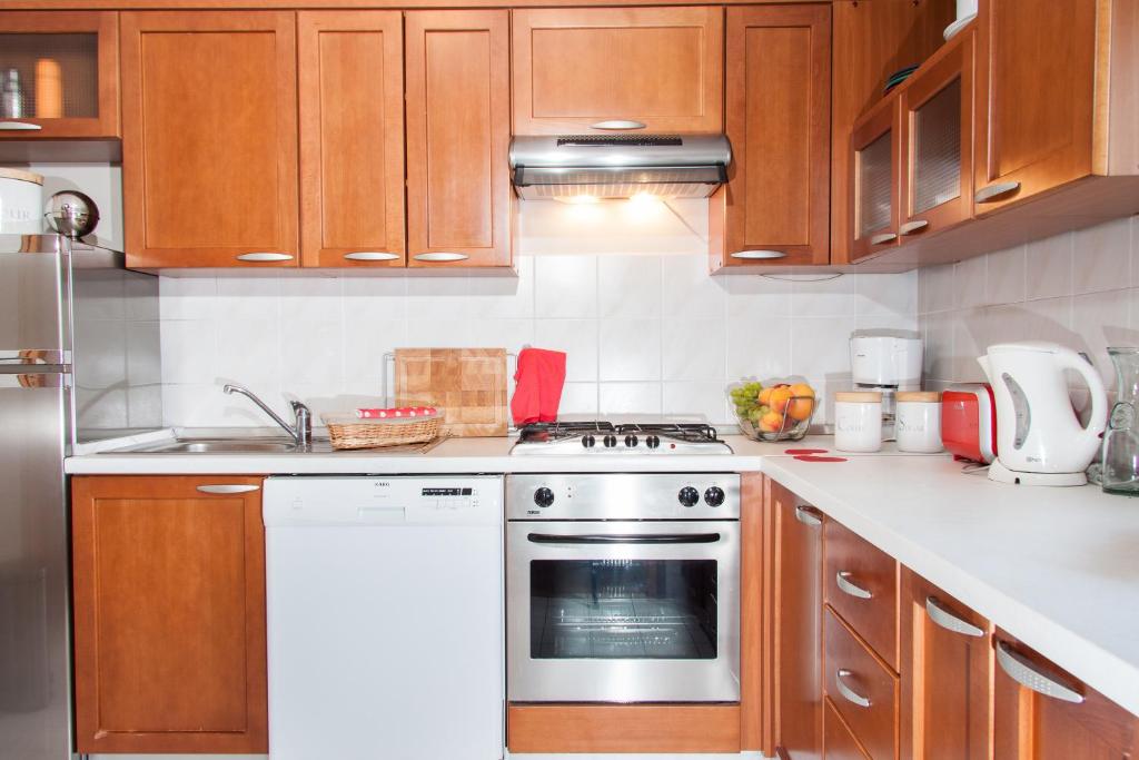 Kuchyň nebo kuchyňský kout v ubytování Apartment Avenue