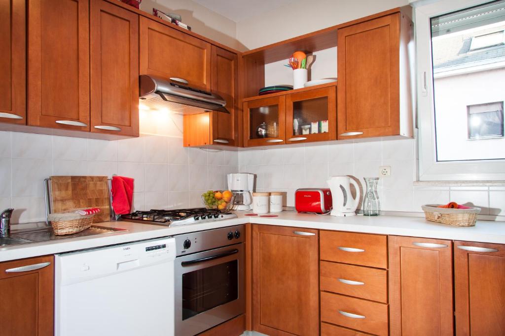 Kuchyň nebo kuchyňský kout v ubytování Apartment Avenue