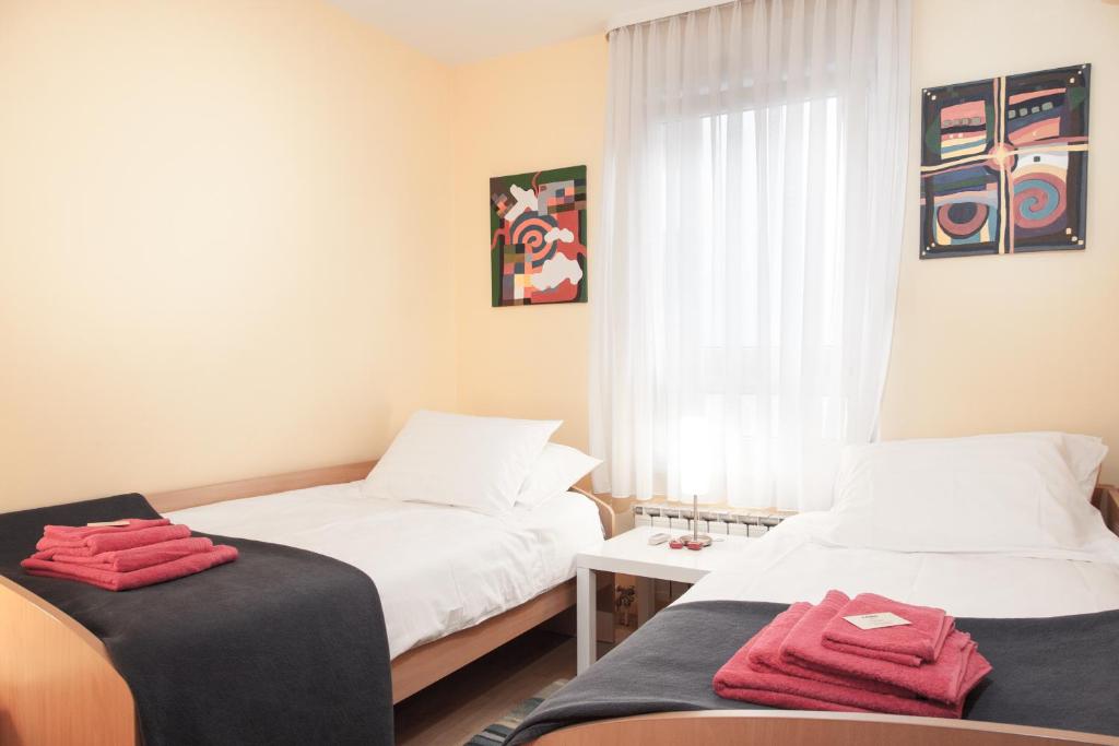 Postel nebo postele na pokoji v ubytování Apartment Avenue