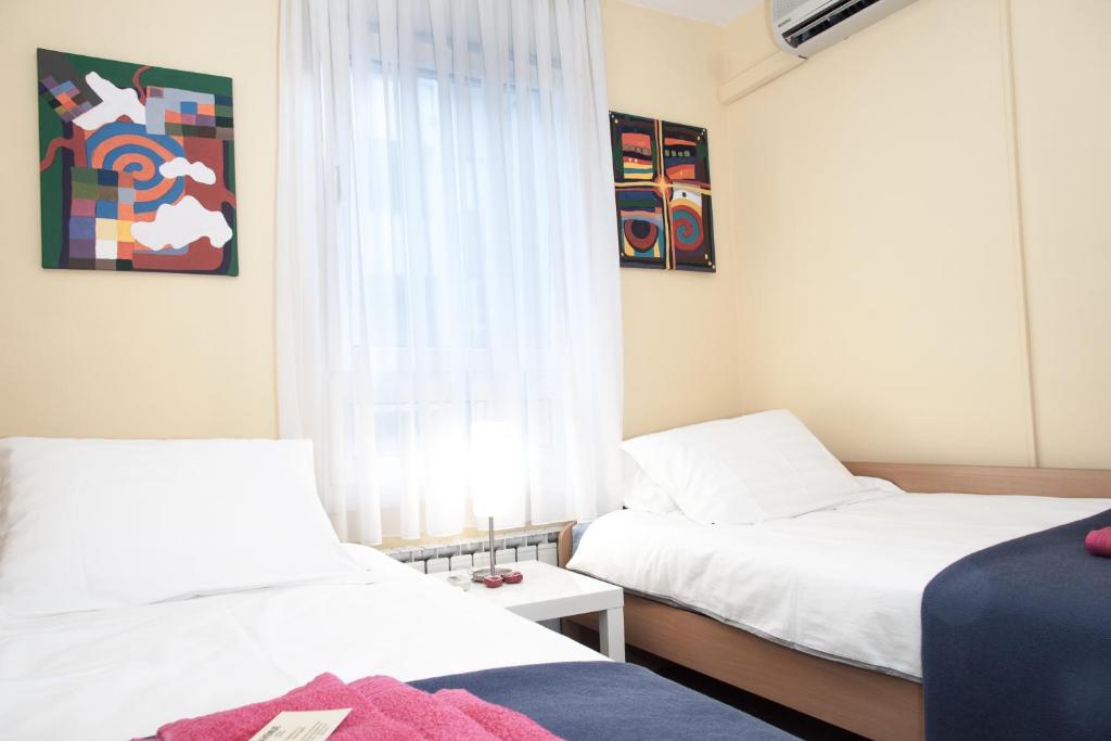 Postel nebo postele na pokoji v ubytování Apartment Avenue