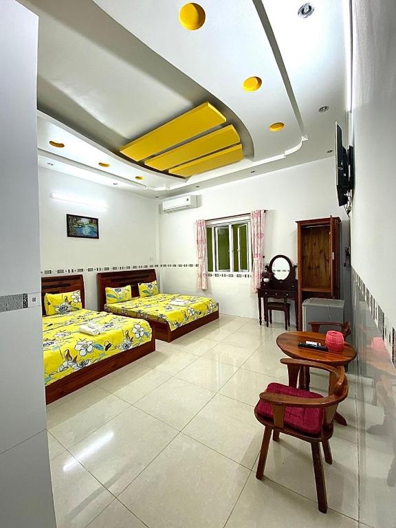 Postel nebo postele na pokoji v ubytování Ngoc May Guesthouse