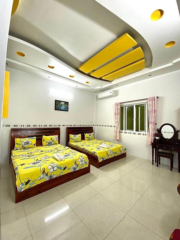 Postel nebo postele na pokoji v ubytování Ngoc May Guesthouse