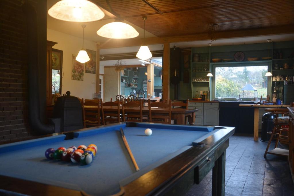 a pool table in a living room with at B&B La Source Houffalize in Houffalize