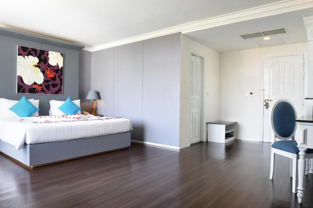 Postel nebo postele na pokoji v ubytování Memoire Siem Reap Hotel