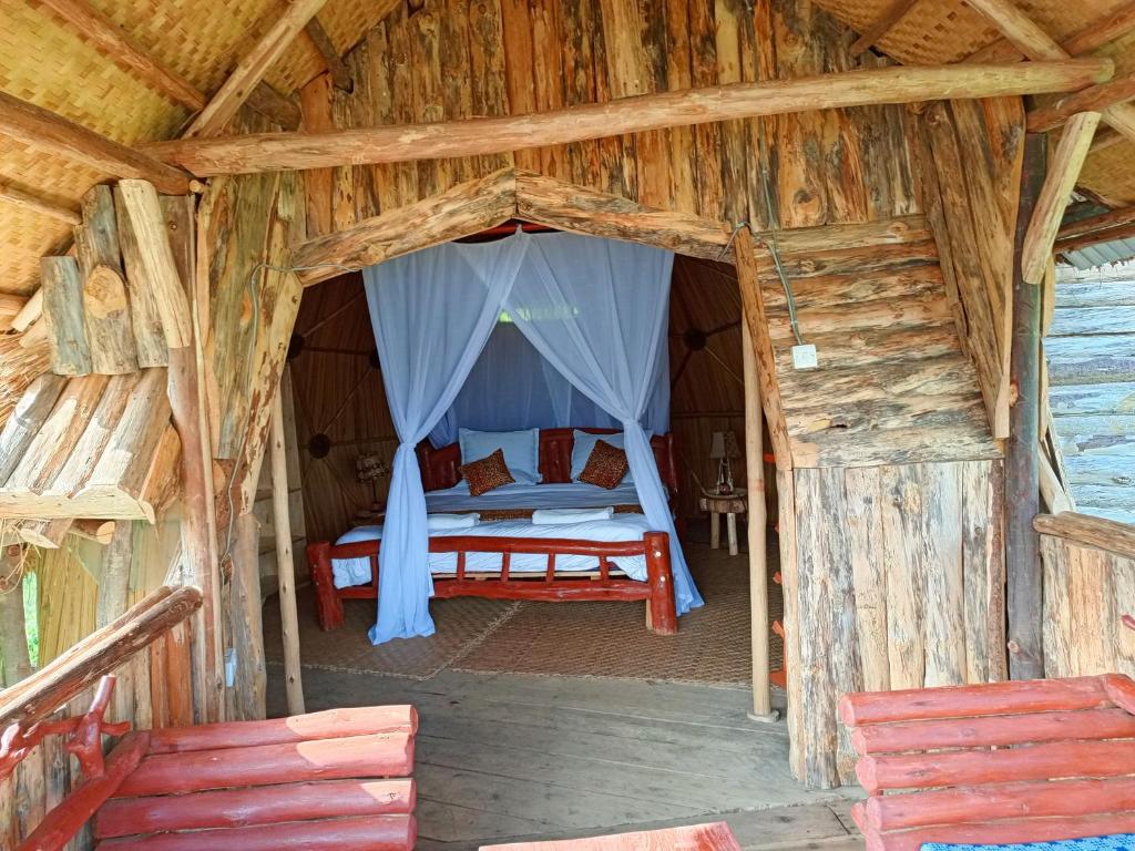Postel nebo postele na pokoji v ubytování Paradise Eco-Hub