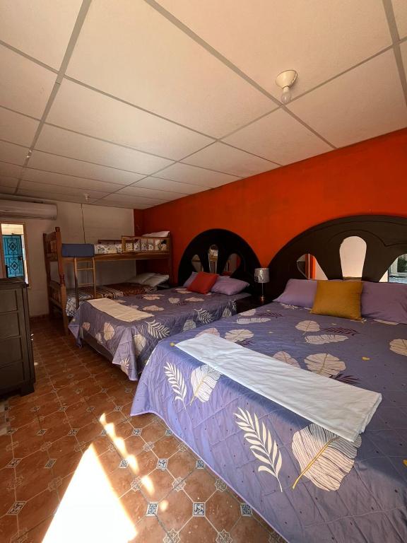 En eller flere senge i et værelse på Rancho de monica