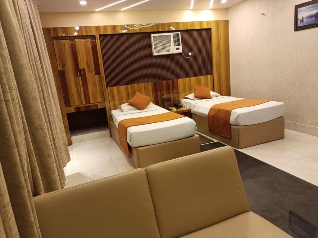 Postel nebo postele na pokoji v ubytování Hotel Executive Tower