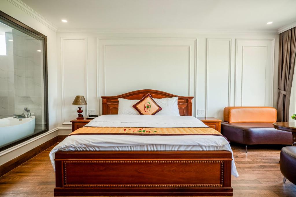 Postel nebo postele na pokoji v ubytování Phu My Hai Hotel