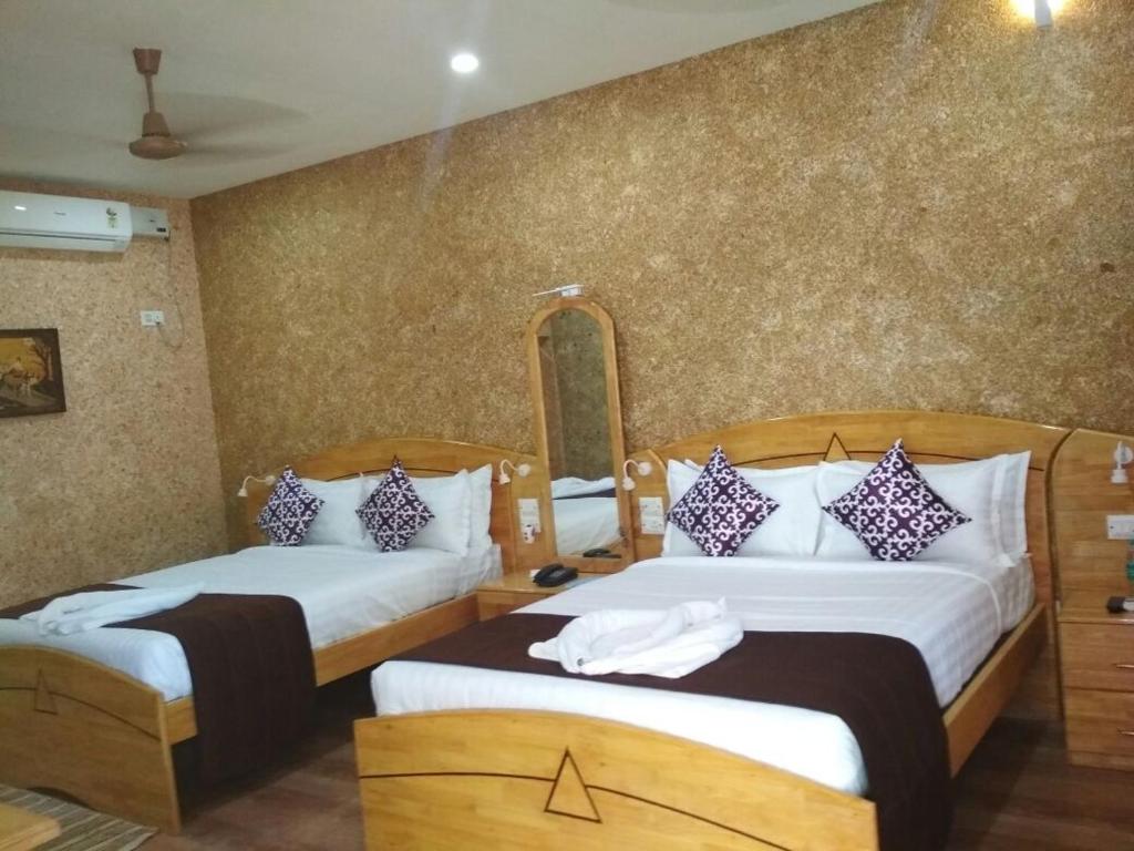 Ein Bett oder Betten in einem Zimmer der Unterkunft Royal Villa Beach Resort
