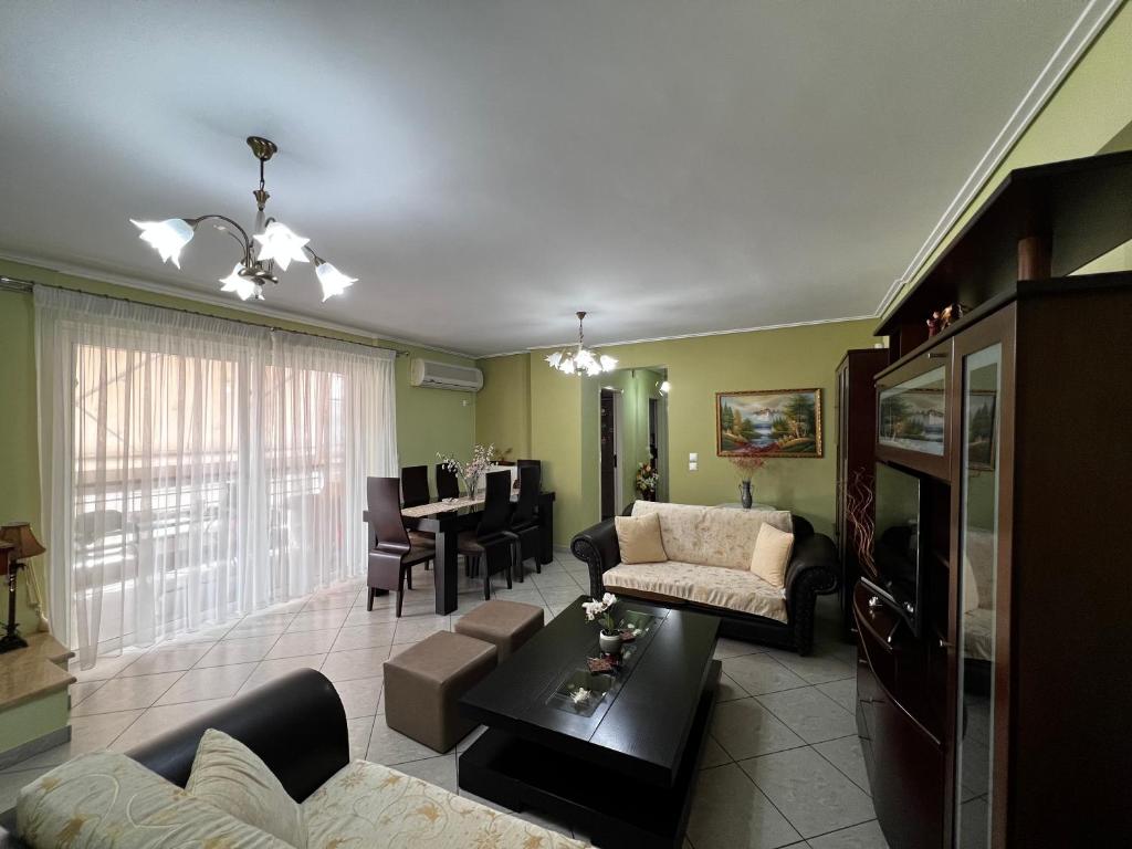 a living room with a couch and a table at Premium Apartment In Chalkida in Chalkida