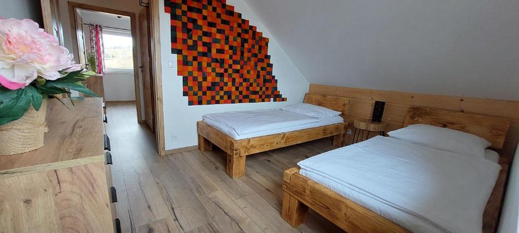 Postel nebo postele na pokoji v ubytování Rajderówka