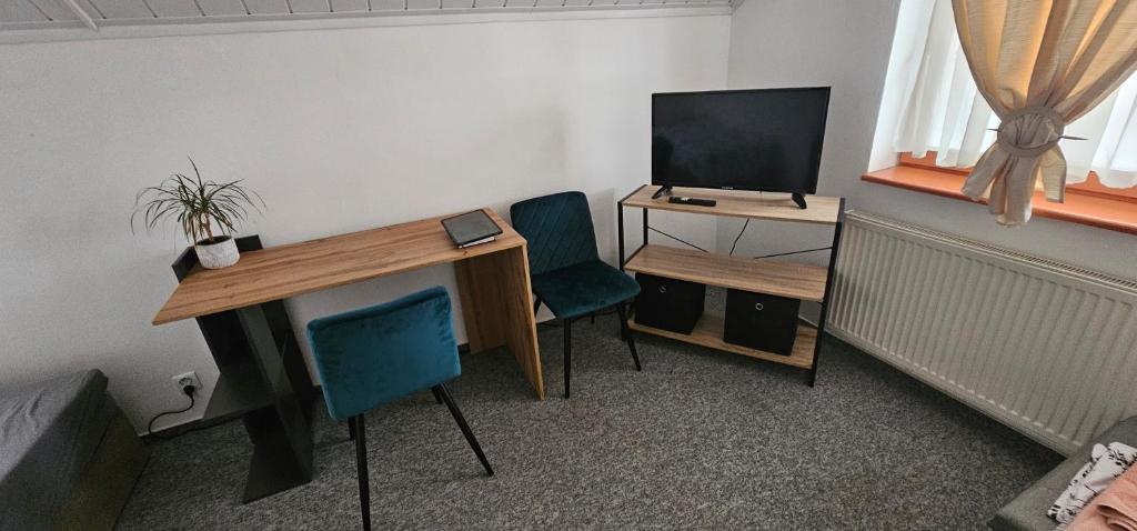 TV a/nebo společenská místnost v ubytování Ubytovanie u Vlka