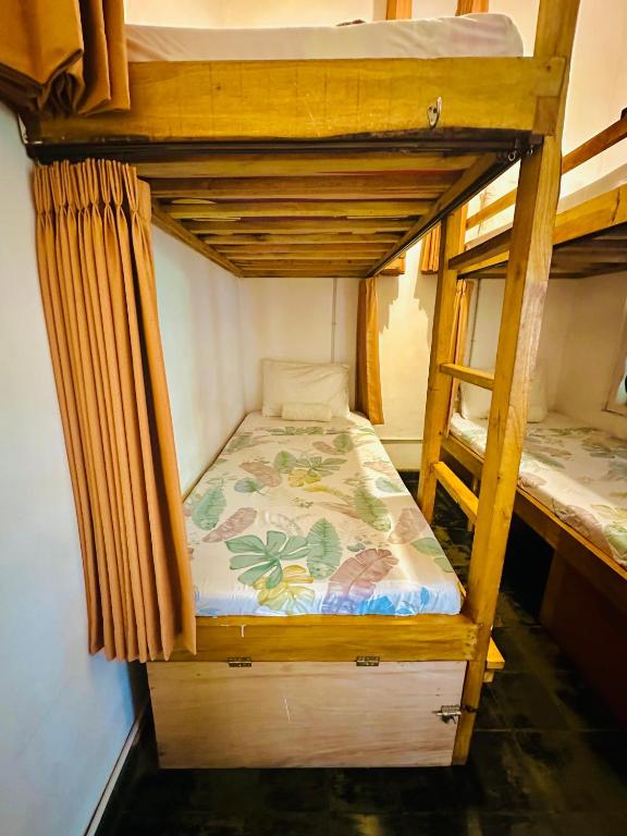 Voodi või voodid majutusasutuse Ijen Backpacker toas