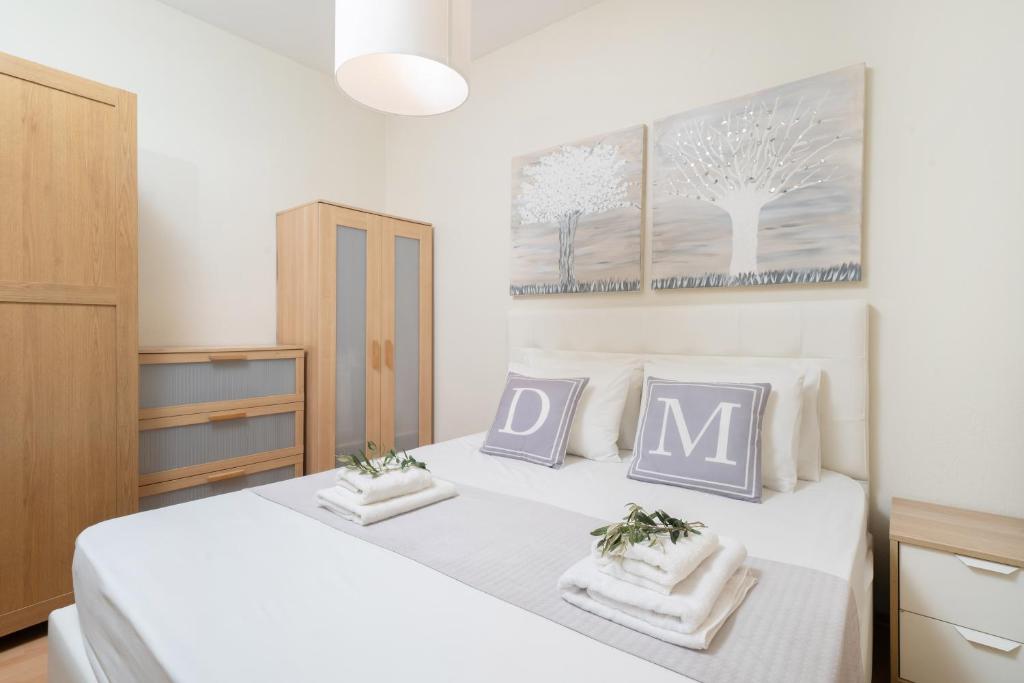 Postel nebo postele na pokoji v ubytování Dimar Apartments