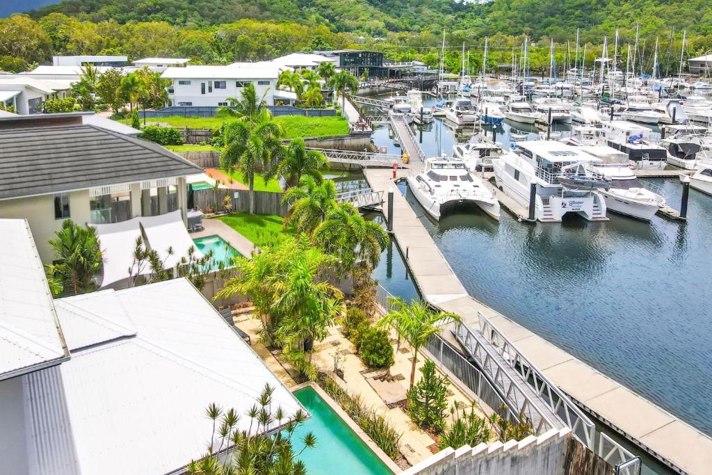 an aerial view of a marina with boats at The Anchorage - Ultimate Waterfront Villa in Yorkeys Knob