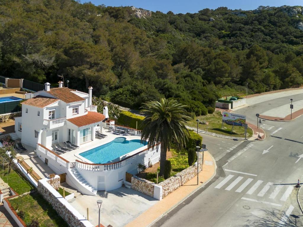an aerial view of a house with a swimming pool at VILLA GERMAN 114 sea views in Son Bou