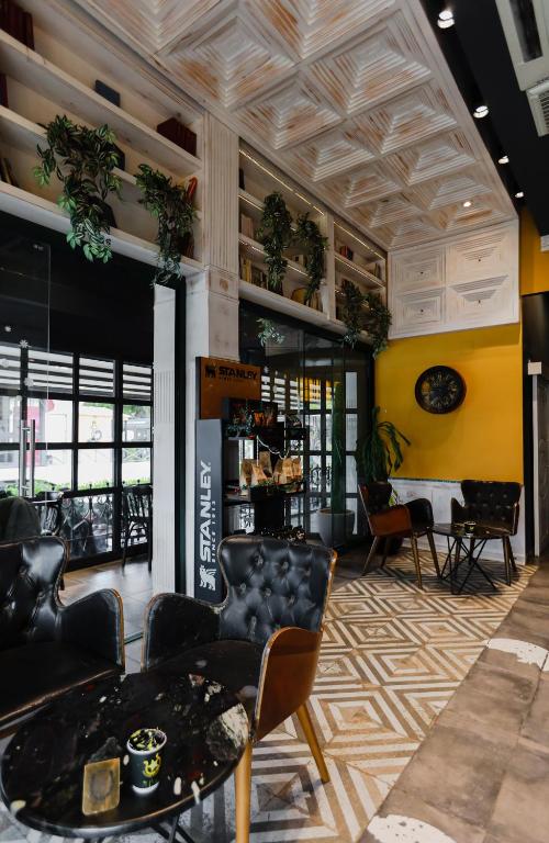 a lobby of a store with chairs and tables at Limon Inn Hotel, Taşucu in Tasucu