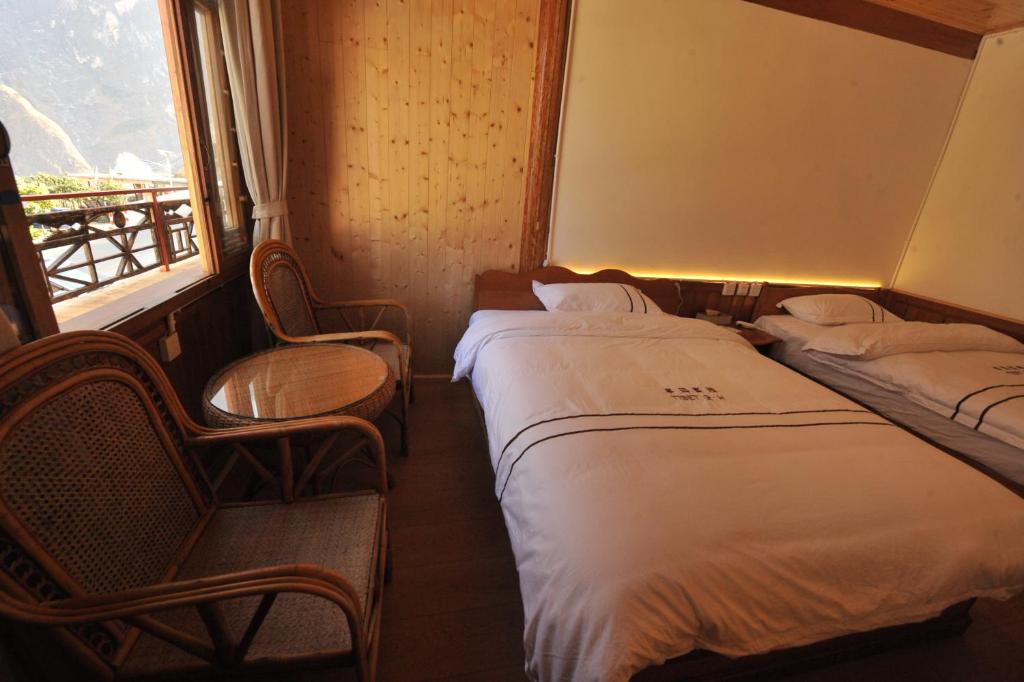 Postel nebo postele na pokoji v ubytování TIBET Guest house 虎跳峡卓玛客栈