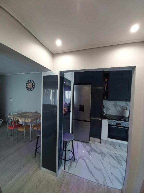 A kitchen or kitchenette at Lovely Faliro Apartment next to the sea.