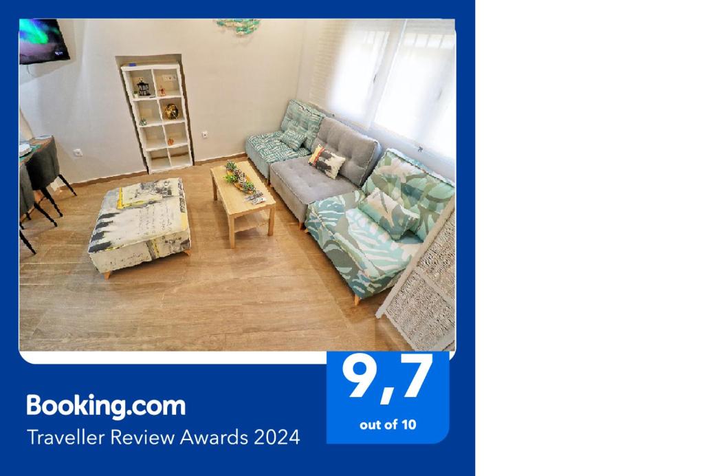 a living room with a couch and a table at APARTAMENTOS MESTRE in Ayamonte