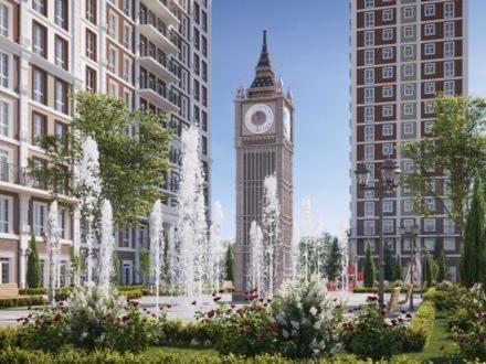 a clock tower with a fountain in a city at Residential complex New England in Kyiv