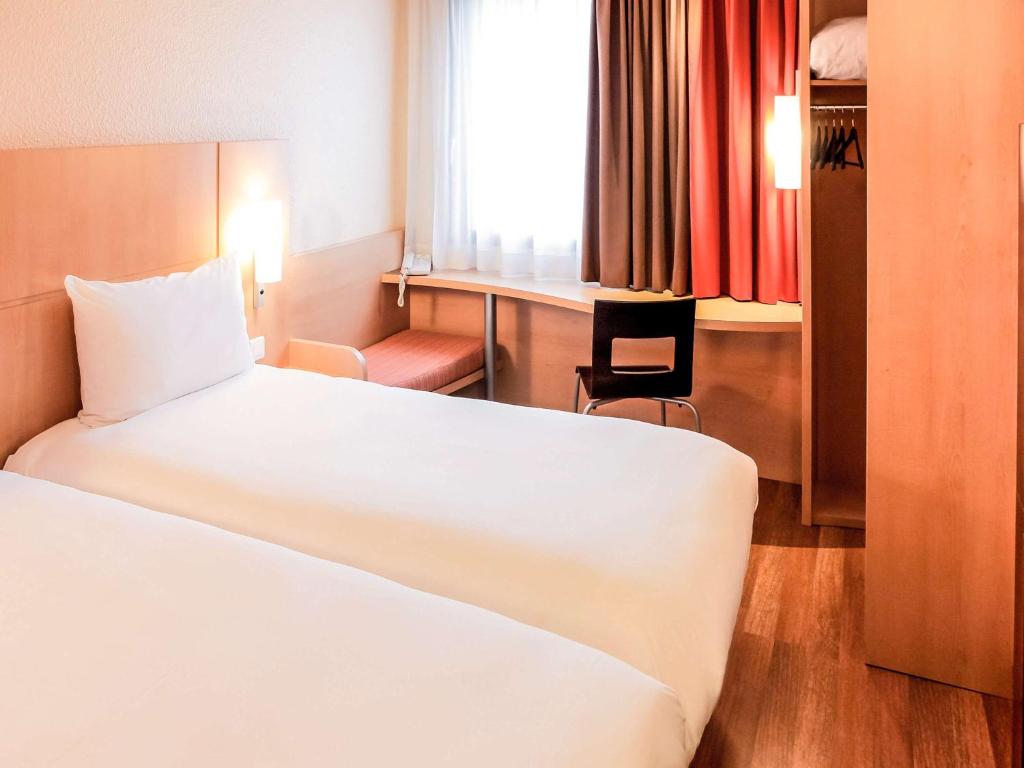 Postel nebo postele na pokoji v ubytování ibis Lyon Gare Part Dieu
