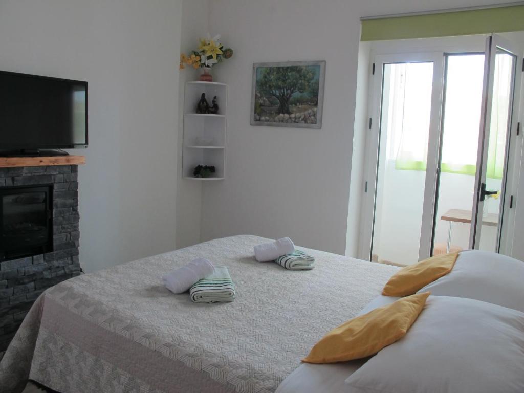 Postel nebo postele na pokoji v ubytování Rooms And Apartment Stambuk II