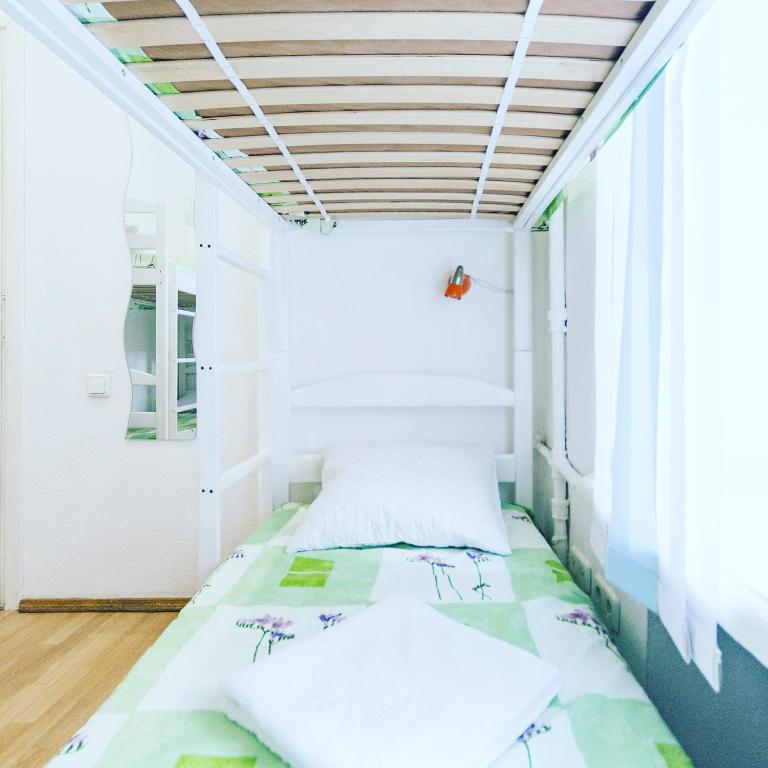 Postel nebo postele na pokoji v ubytování Muzey Hostel