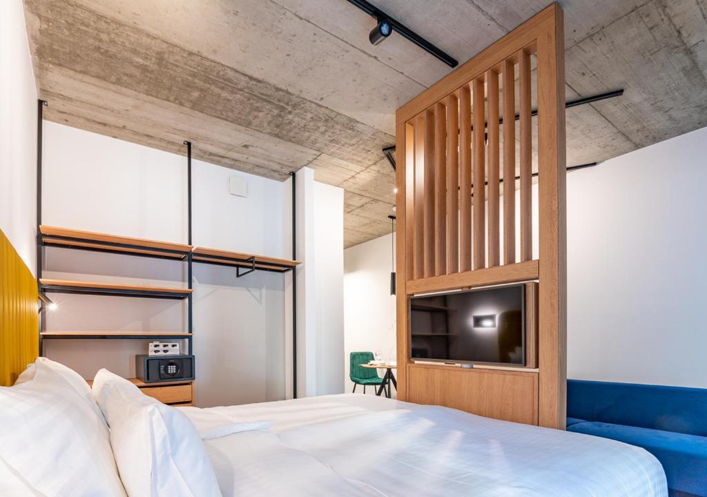 Postel nebo postele na pokoji v ubytování Noir Hotel