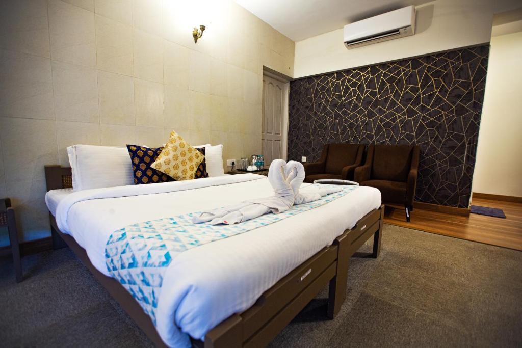 Postel nebo postele na pokoji v ubytování Hotel Bela Goa