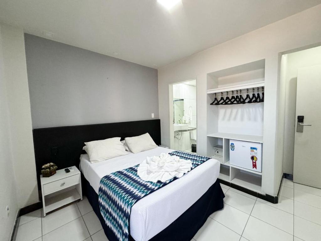 Ένα ή περισσότερα κρεβάτια σε δωμάτιο στο Ritz Praia Hotel