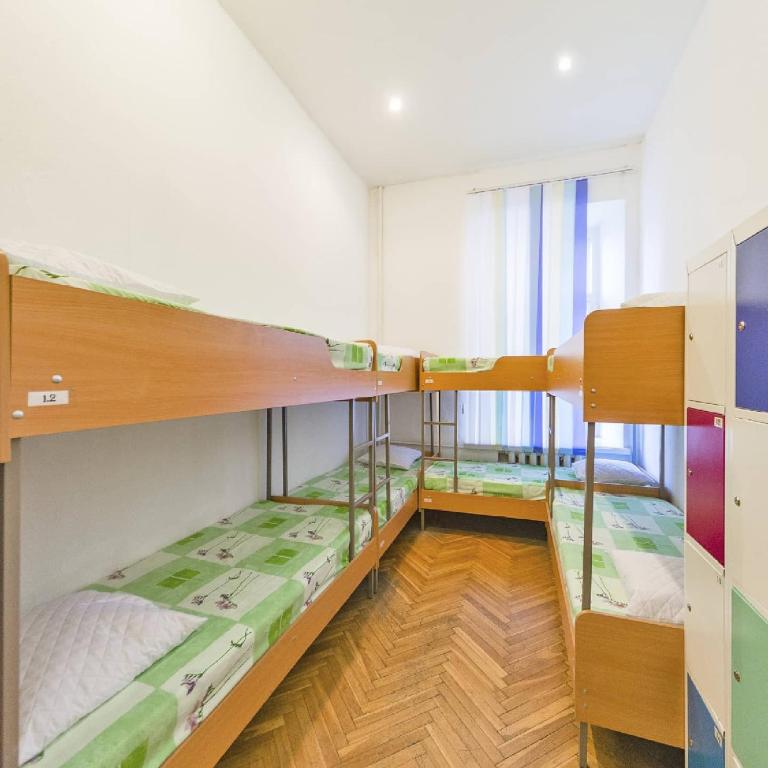 Postel nebo postele na pokoji v ubytování Muzey Hostel