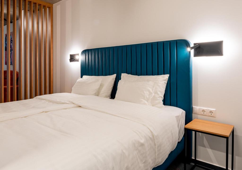 Postel nebo postele na pokoji v ubytování Noir Hotel
