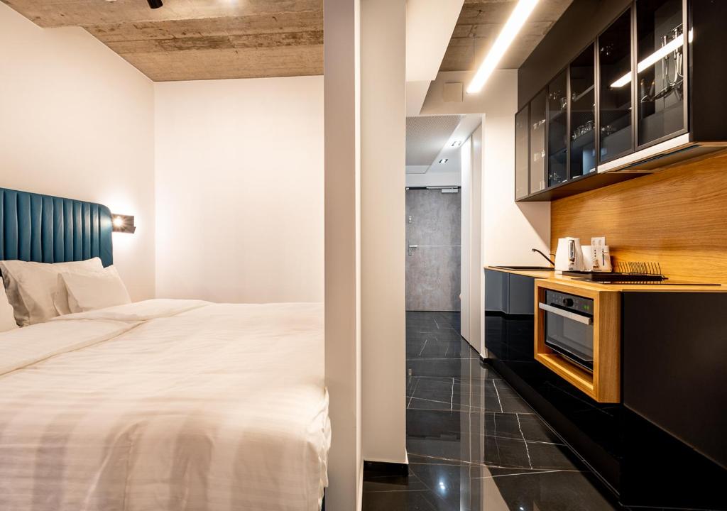 Postel nebo postele na pokoji v ubytování Noir Hotel
