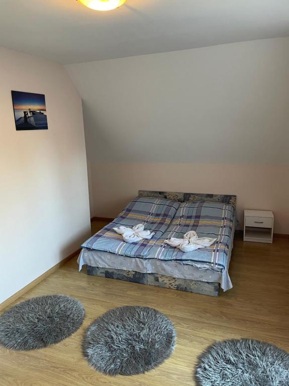 Postel nebo postele na pokoji v ubytování Ponty Apartman