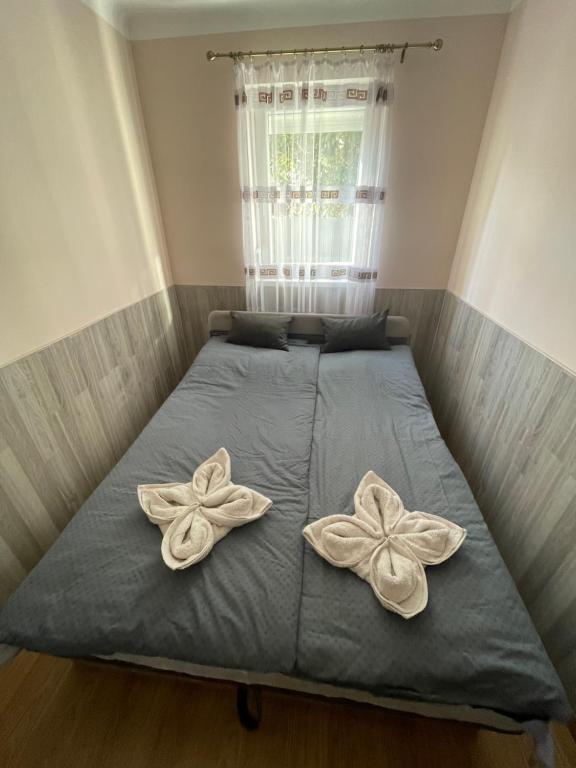 Postel nebo postele na pokoji v ubytování Ponty Apartman