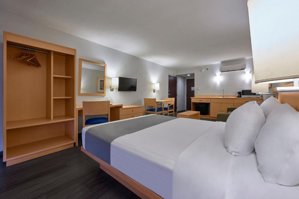 Postel nebo postele na pokoji v ubytování City Express by Marriott Tula