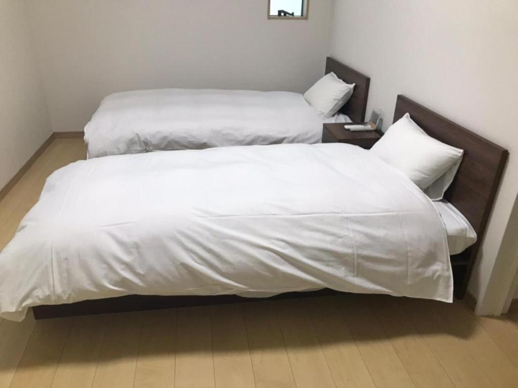 Postel nebo postele na pokoji v ubytování 5 minutes Shin-Osaka 3