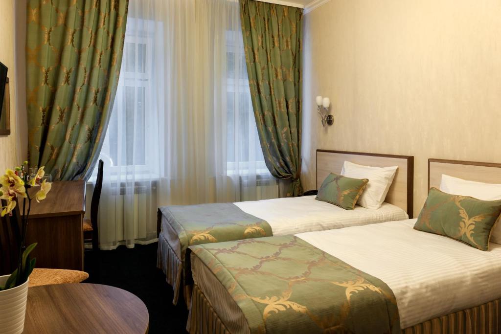 Кровать или кровати в номере Отель Seven Hills Брестская