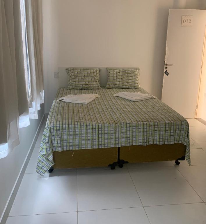 Postel nebo postele na pokoji v ubytování VIRASSOL Praia Hotel
