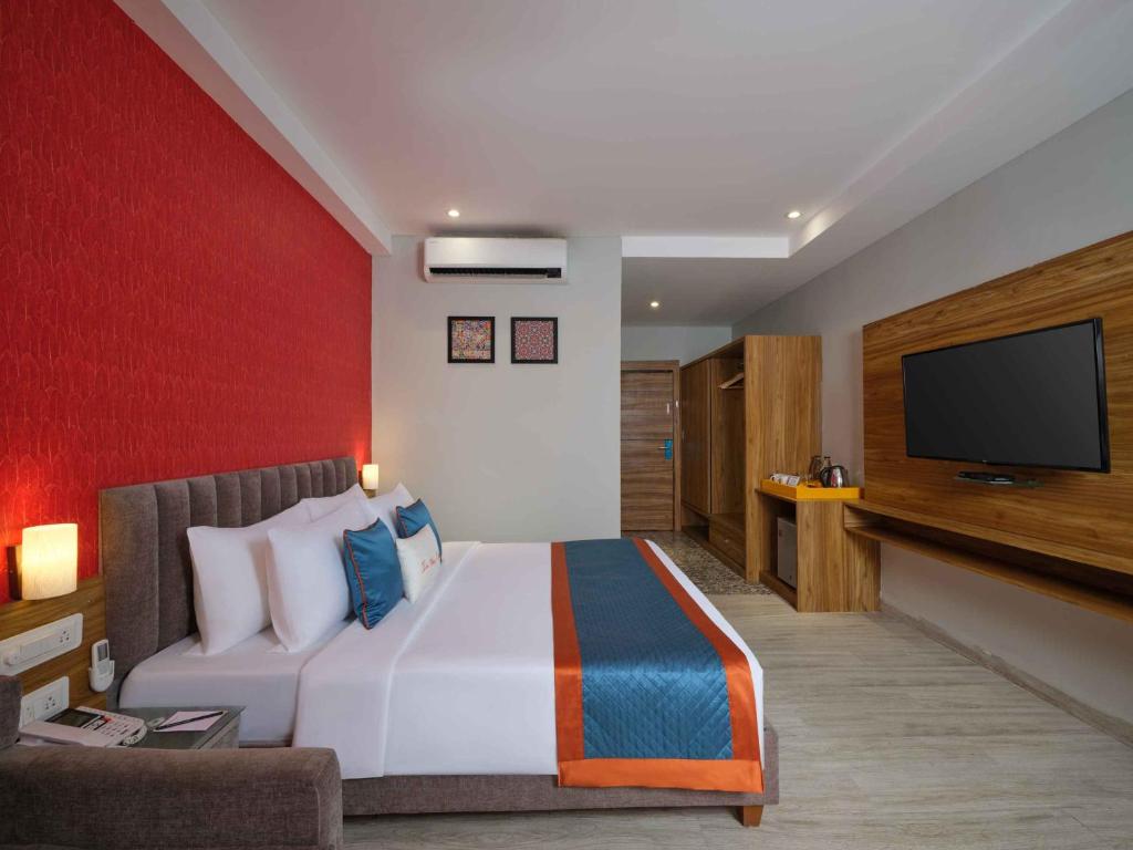 Postel nebo postele na pokoji v ubytování Simcha Island, Indore