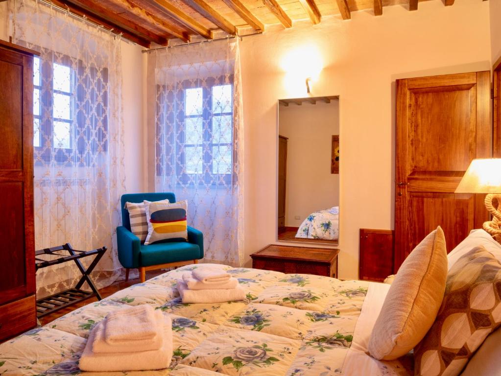 Posteľ alebo postele v izbe v ubytovaní Podere Vergianoni immerso nelChianti con piscina