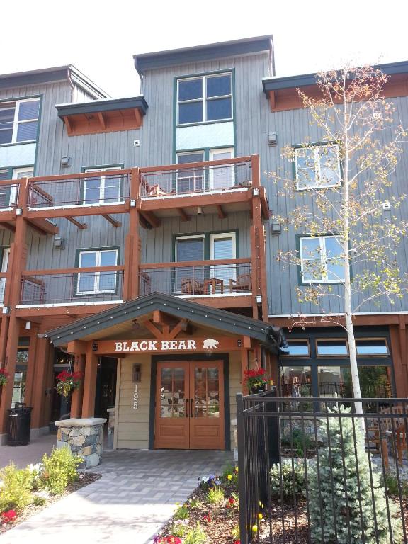 a large building with a black bear sign on it at Jackpine & Black Bear Condos by Vail Resorts in Keystone