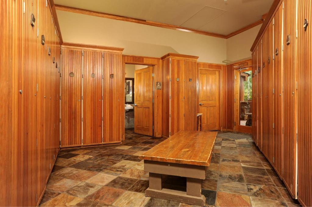 a room with wooden lockers and a wooden table at Jackpine & Black Bear Condominiums by Keystone Resort in Keystone
