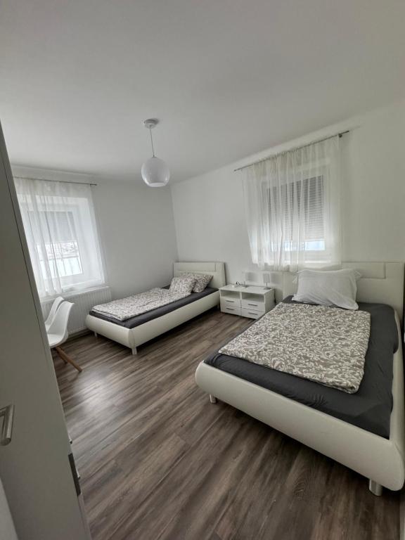 Кровать или кровати в номере Apartment Vlora-Naturblick